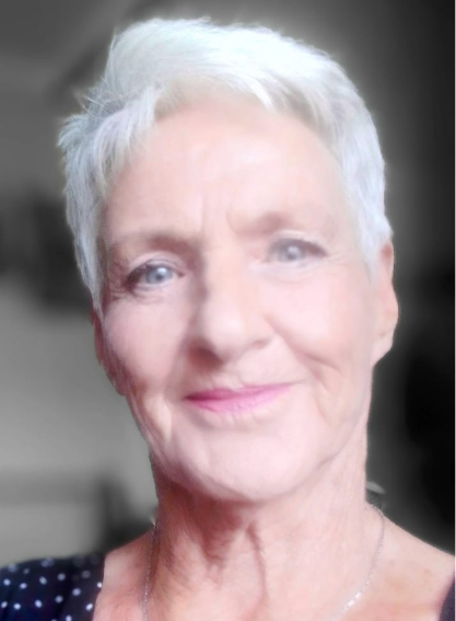 Debbie, who provides the house and pet sitting, smiling